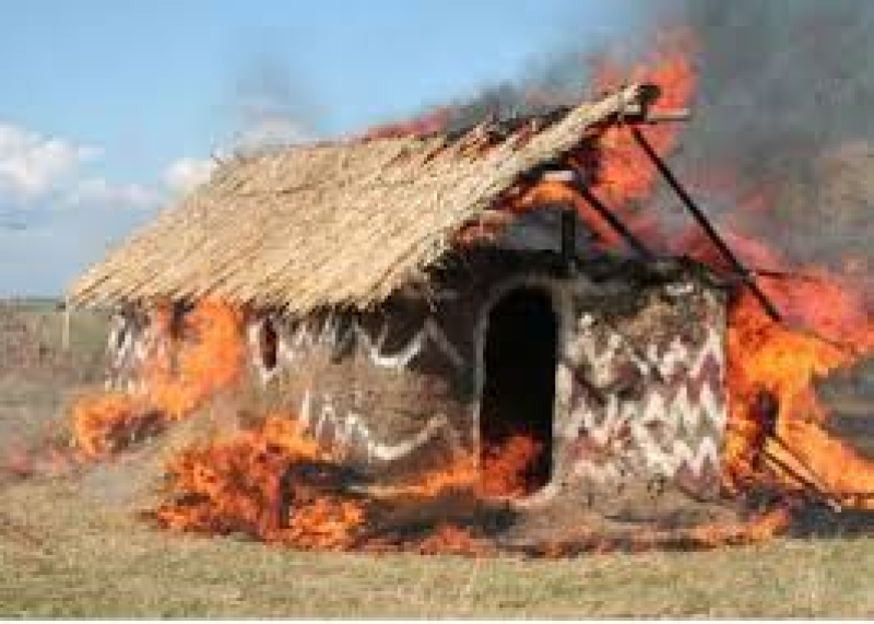 One of the huts on fire